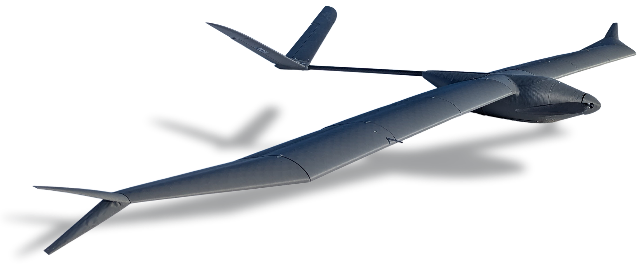 The Crow airframe seen from the front quarter: a long high-aspect-ratio
                wing, a V-tail carried on a slim boom, and a folding propeller at the
                nose.