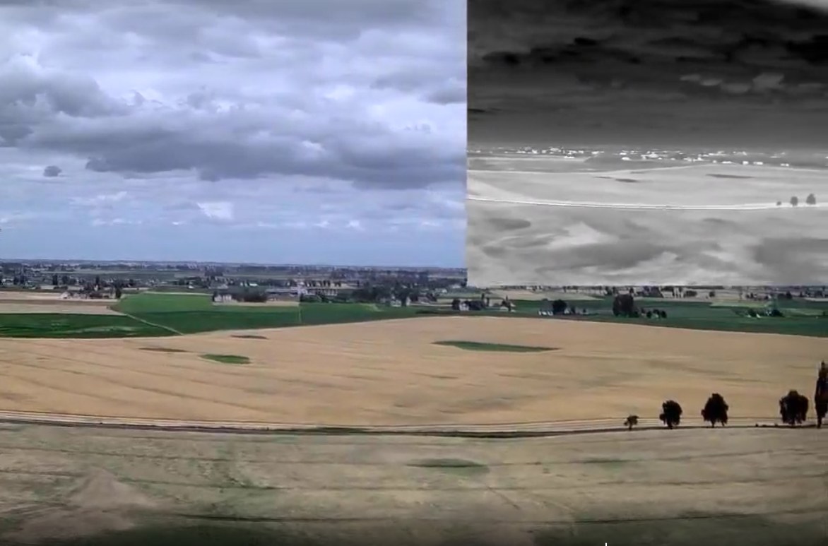 A frame from the aircraft: the visible image full frame with the thermal
                    channel inset in the top right corner.